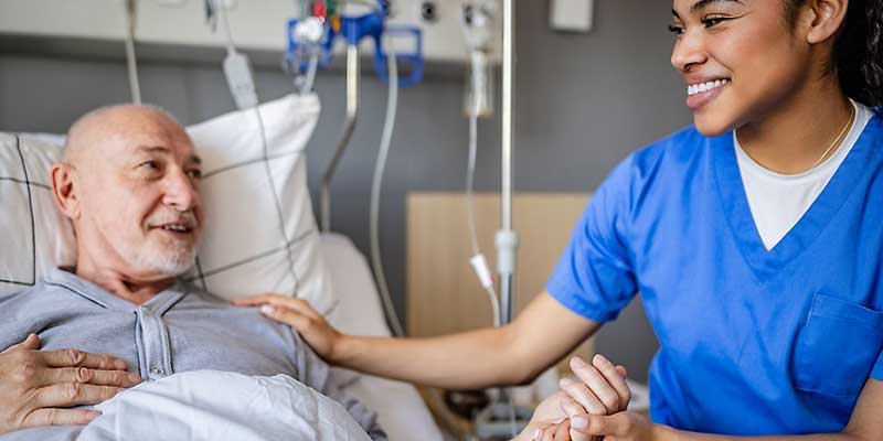 A nurse comforting a patient