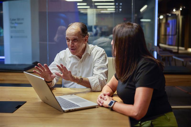 Richard Boscovich, Assistant General Counsel, DCU in conversation during a meeting.