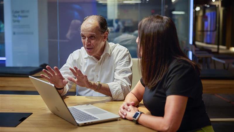 Richard boscovich, assistant general counsel, dcu in conversation during a meeting.