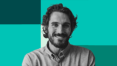 A man smiling and posing for camera