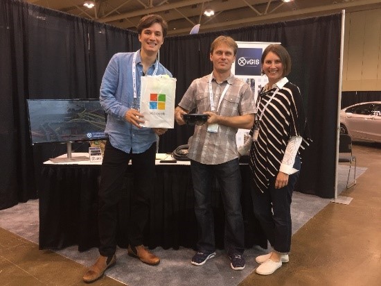Photograph of Meemim team members at a trade show