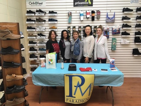 Photograph of Paradigm Medical team members standing together in their store