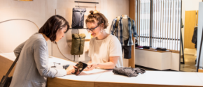 Image showing a customer purchasing some clothes in a retail store.