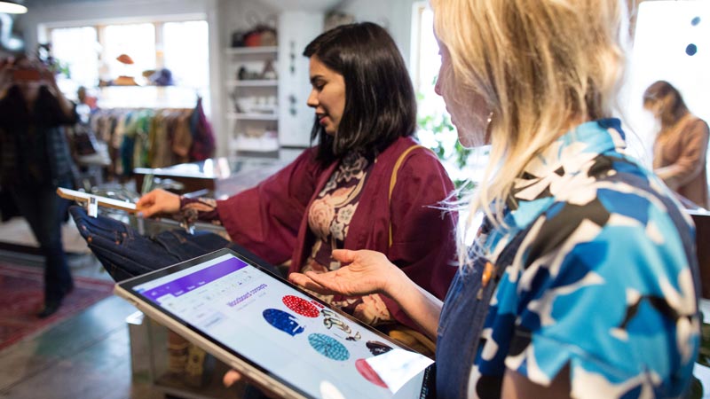 Shop assistant helping a customer in a retail environment