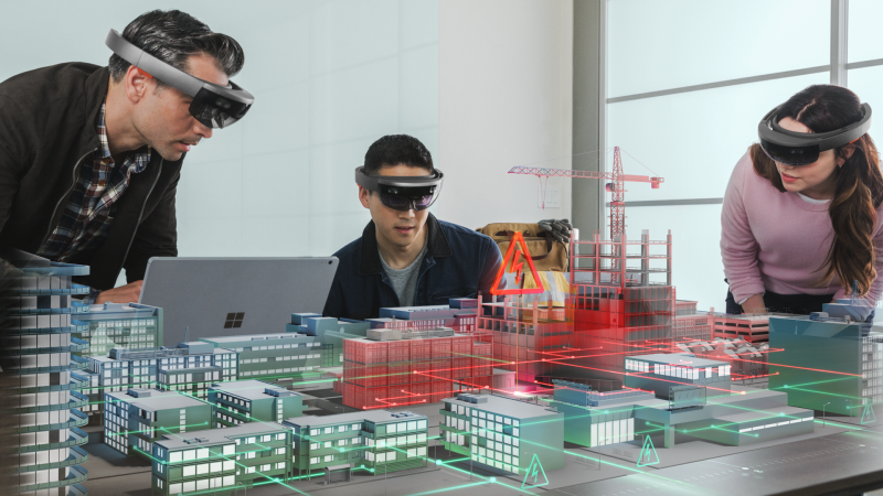 Group exploring a digital twin of a city power grid hologram with Microsoft HoloLens for the purpose of situation response to public utility emergency