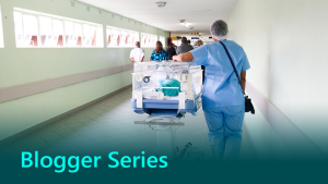 Blogger series thumbnail showing hospital staff in a hospital corridor.