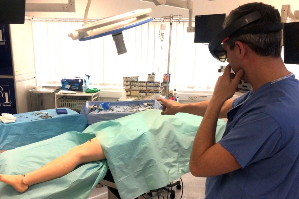 Surgeon wearing HoloLens in an operating theatre