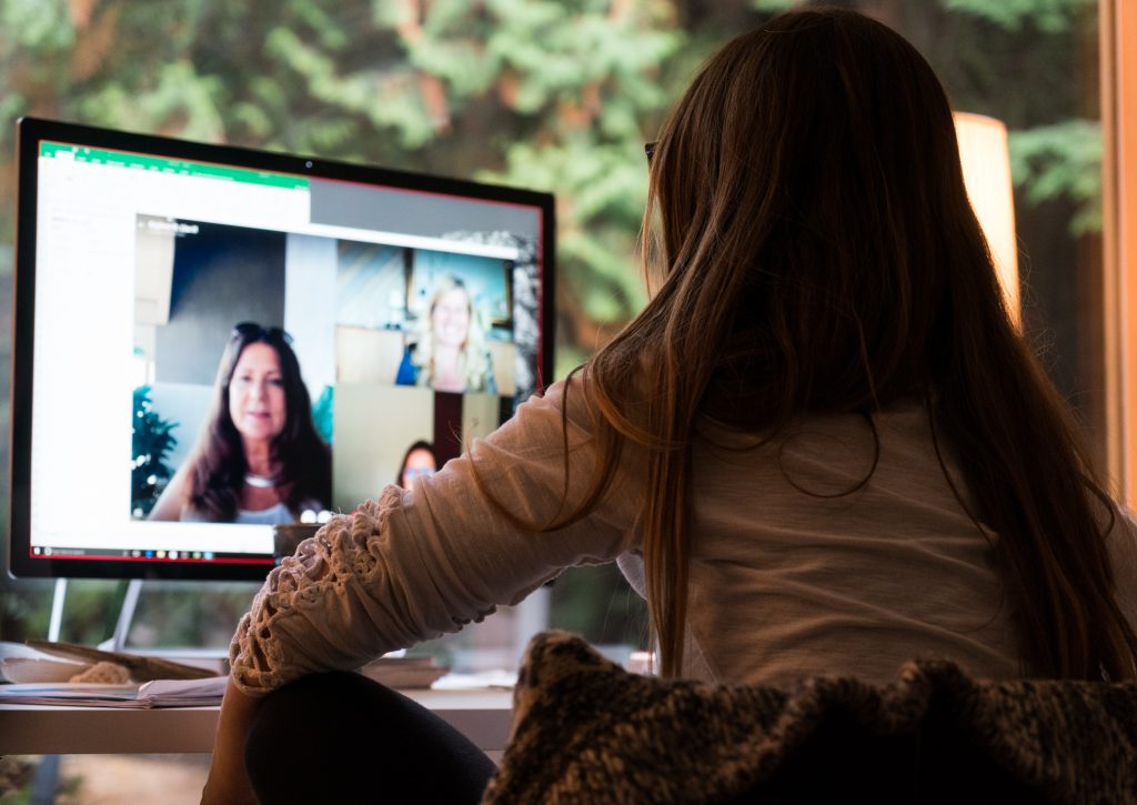 Woman using Skype for work meeting. 
