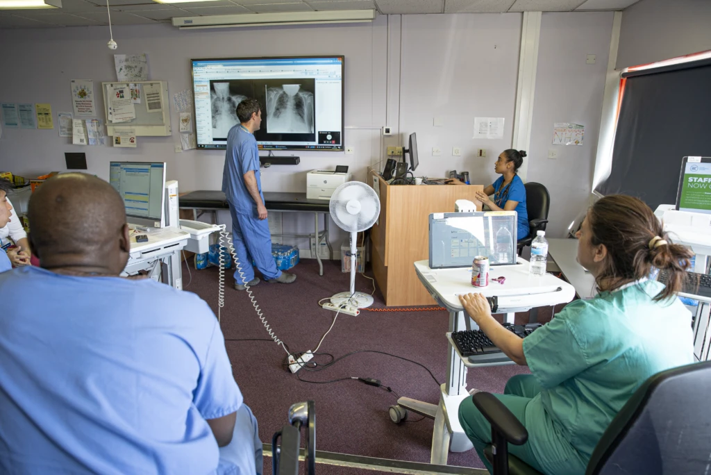 NHS doctors remotely discuss a patient during a Microsoft HoloLens2 virtual ward round during the COVID-19 pandemic