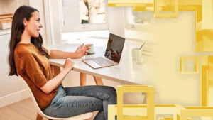 Woman on computer in her home.