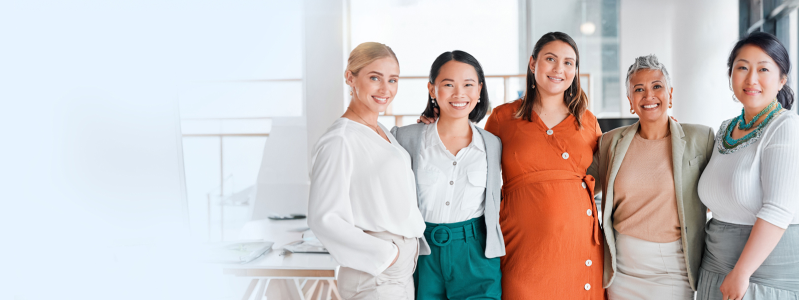 Five women posing with a smile.