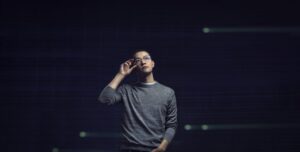 Asian male developer standing hero portrait with Azure geometries as textures in the background, code, developer, engineer, Azure.