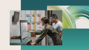 A decorative image of two manufacturing professionals collaborating in a factory