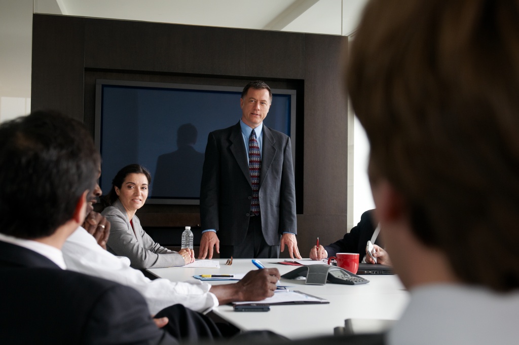 a group of people sitting at a table