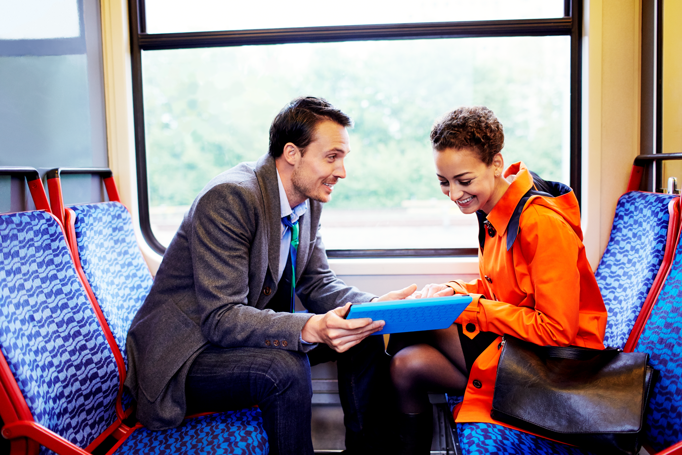 a group of people sitting in front of a window