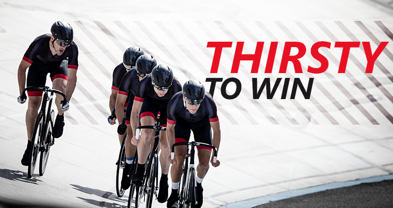 a group of people riding on the back of a bicycle