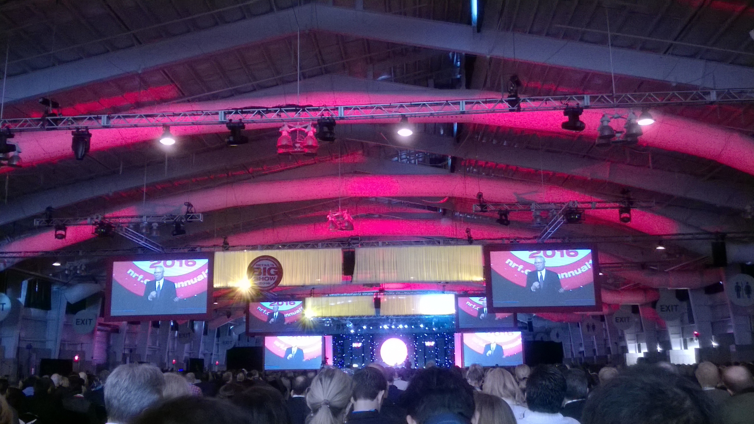 a group of people standing in front of a crowd