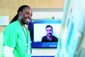 a man standing in front of a television