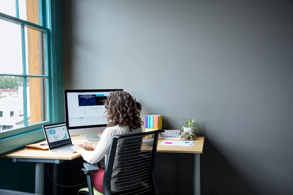 a laptop computer sitting on top of a desk