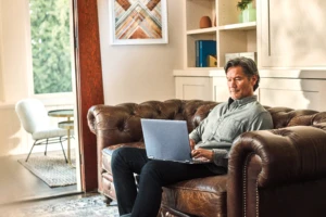 Man interacting with a Leno Yoga laptop.