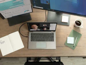 A Dell Latitude 7410 configured with a multi-monitor set-up displaying Microsoft Teams, Excel, Power BI and Windows Start menu. Remote Working collection. Keywords: remote work, remote working, work from home, working at home, home office, telecommuting, video conference, video call, Microsoft Teams