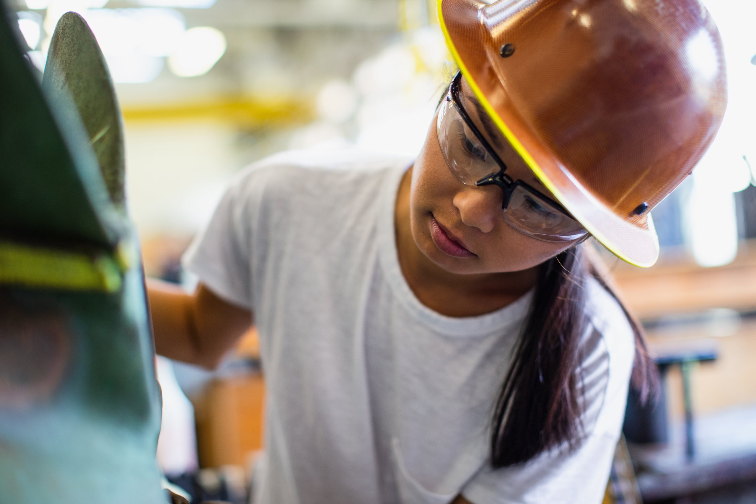 Female worker in shipbuilder‘s machine shop.