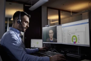 a person sitting in front of a computer