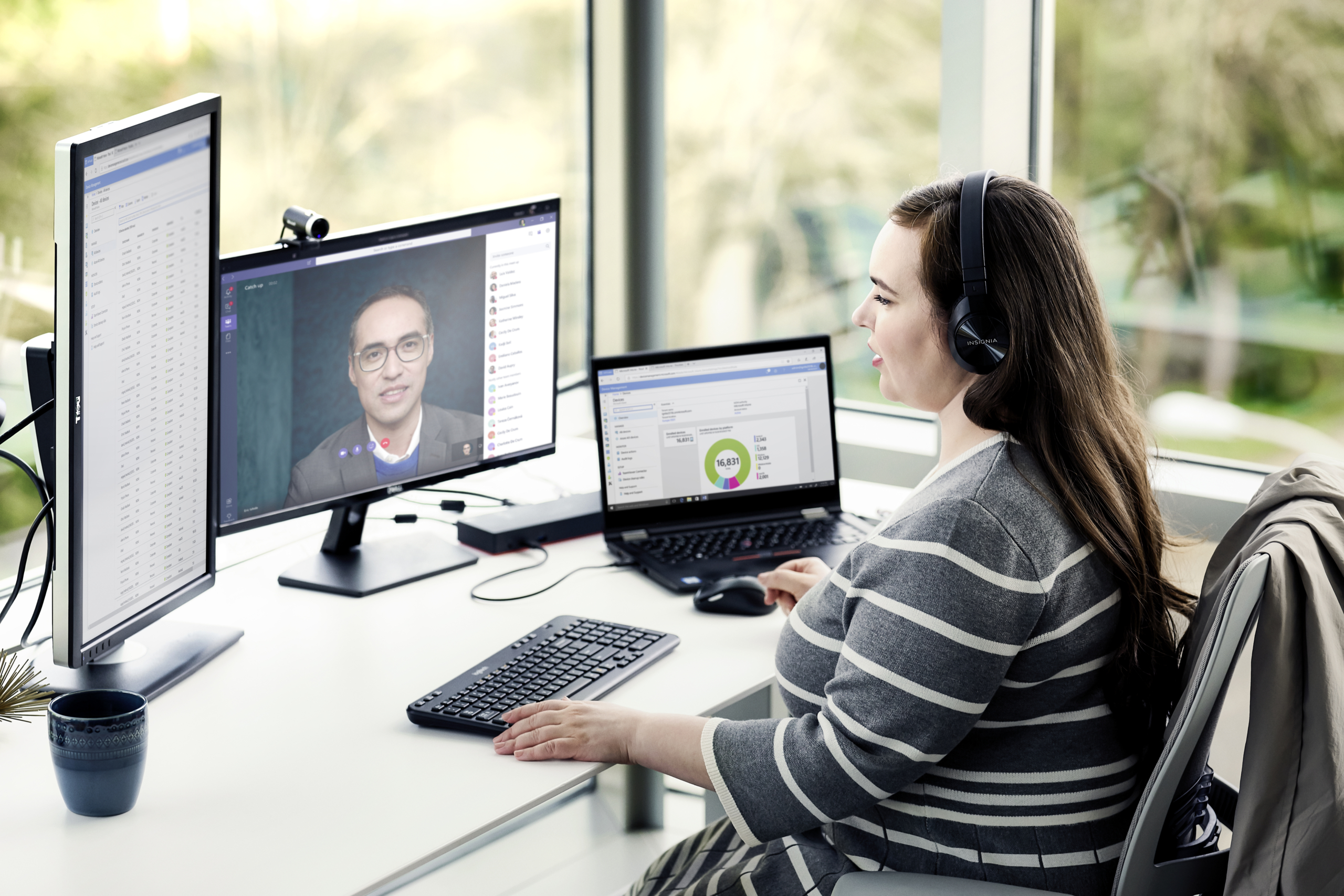 Female enterprise employee working remotely from home on a Lenovo device, running Microsoft Teams, Word and Excel