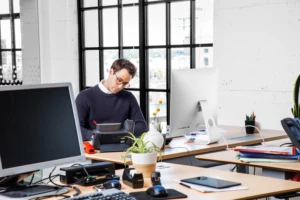 man working at desk in office