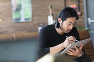 Small business male with Surface in modern workplace.