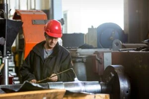 Male worker welding in the shop; manufacturing environmental image.