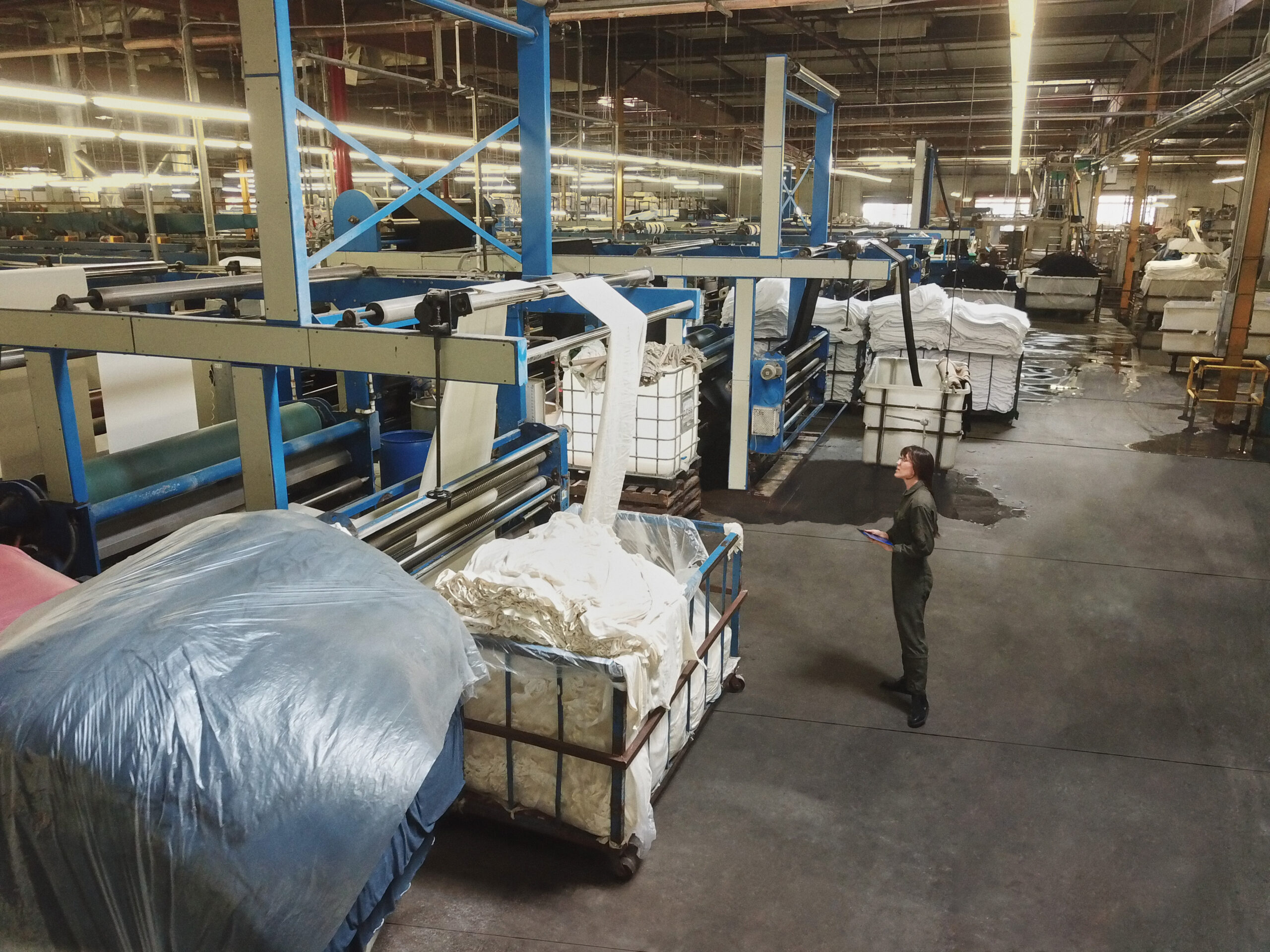 Photo of a worker taking inventory in a warehouse.