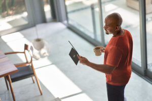 Photo of a seller taking a sales call on a laptop.