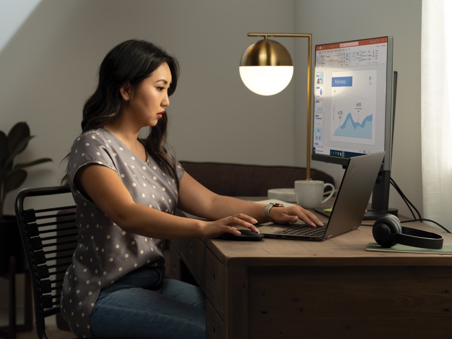 A woman sitting at a desk in front of a computer