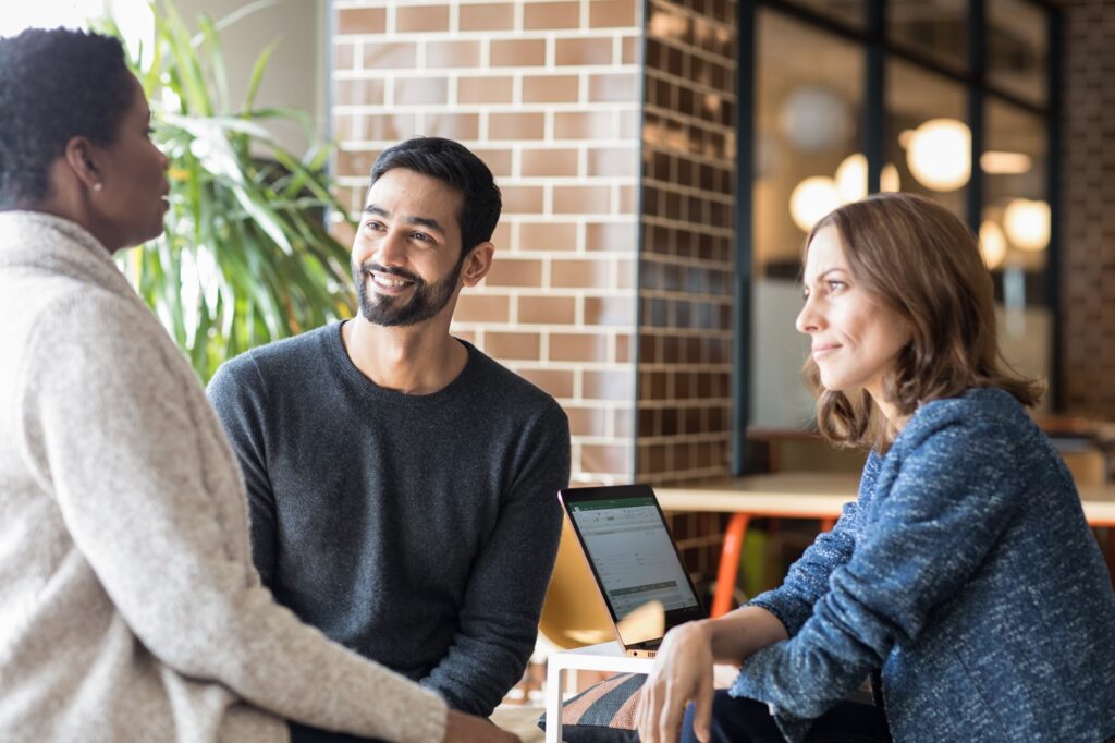 Enterprise team discussing AI in modern workplace.