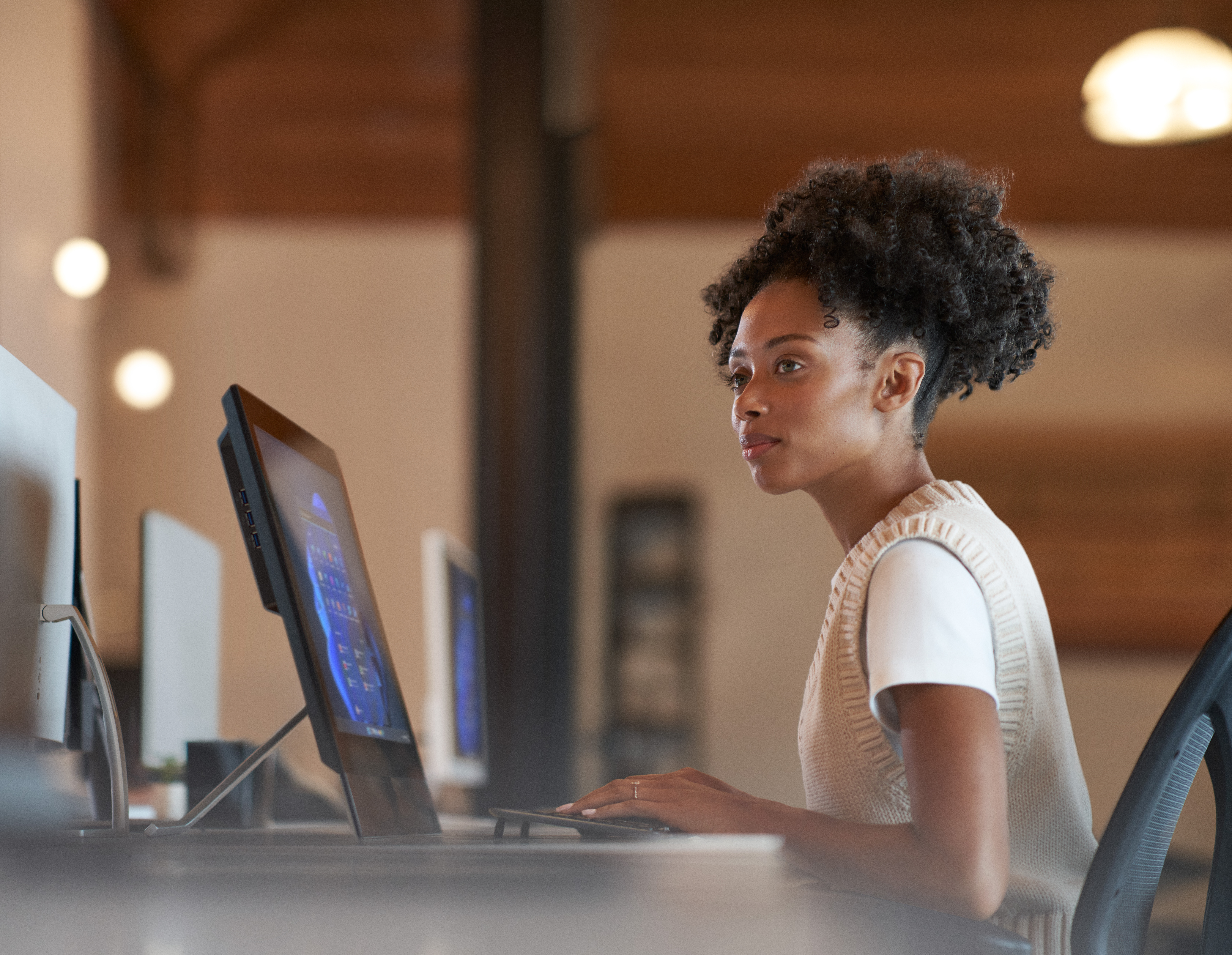 Enterprise office worker in focused work with a neutral facial expression