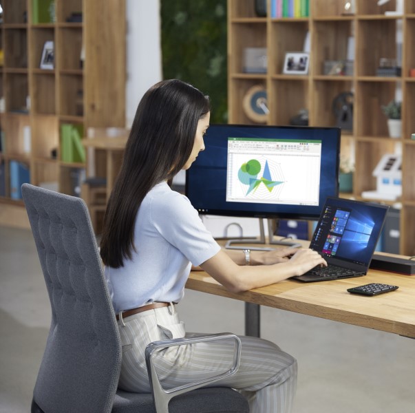 a woman sitting at a desk