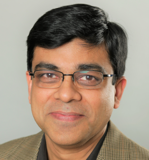 Person wearing a textured blazer in front of a plain background