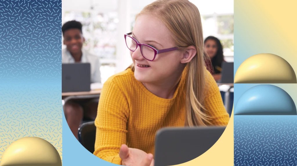 A student using a laptop in a classroom.