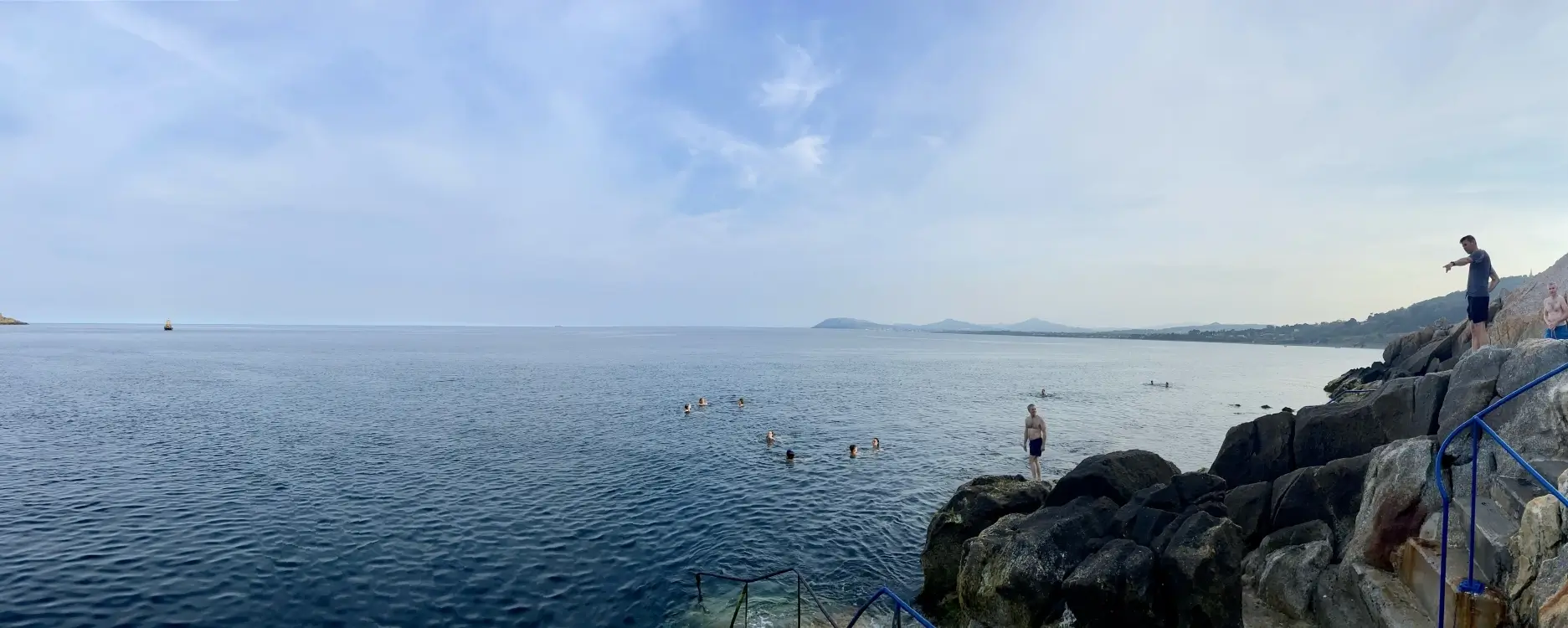 People jumping off the cliff into Vico Baths of Ireland