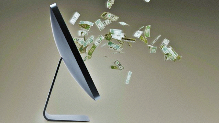An image of a currency bills coming out of a computer screen