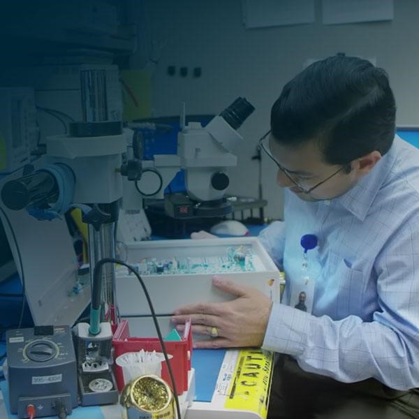 Man with microscope and medical supplies