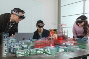 People using hololens to visualize a construction project/city planning.