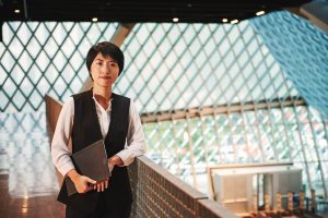 Woman holding a surface laptop