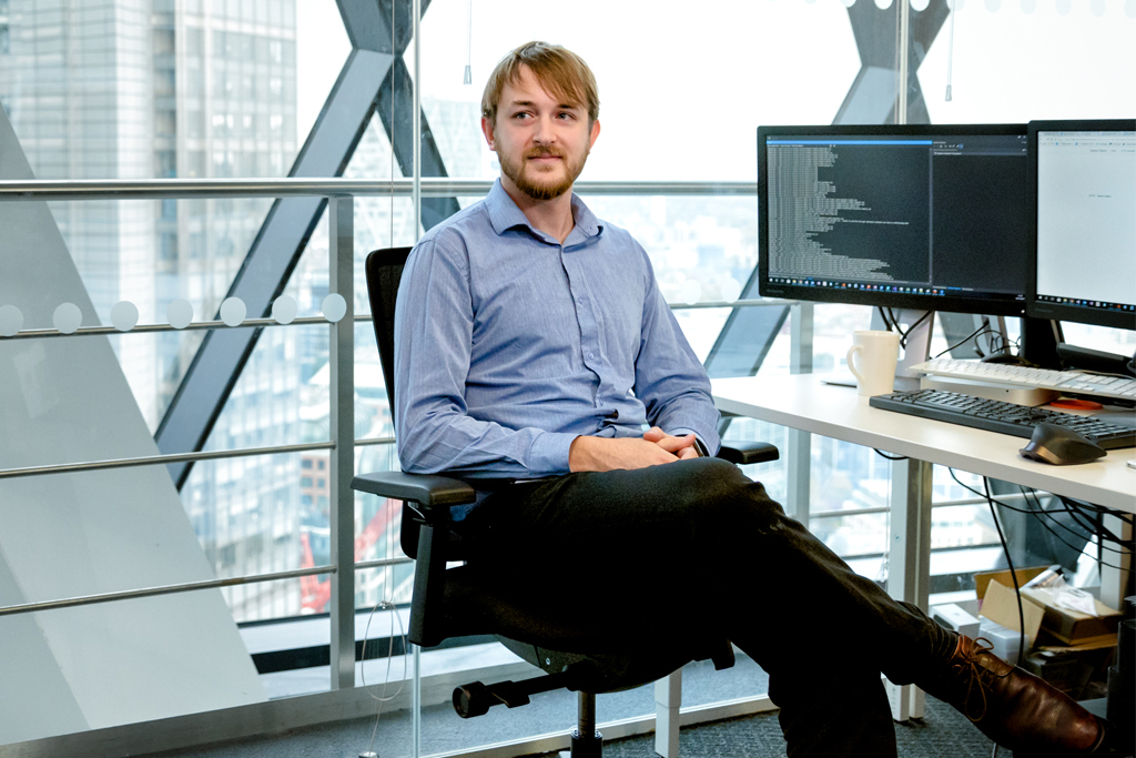 Man sitting at desk with computer