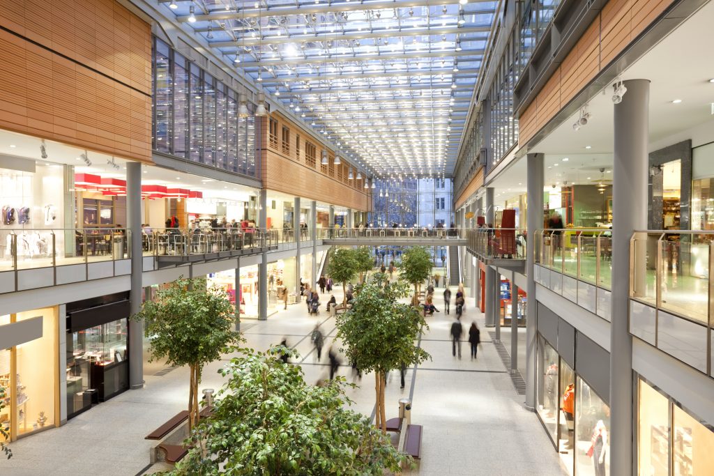 People walking around a large Shopping Mall