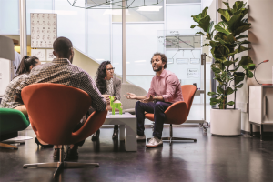 Four people having a meeting