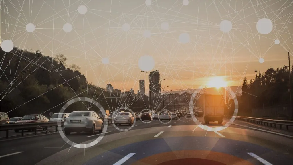 driving down a highway towards the sunset