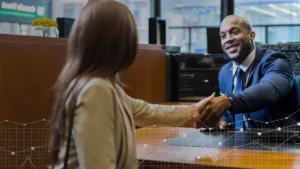 woman shaking a man's hand