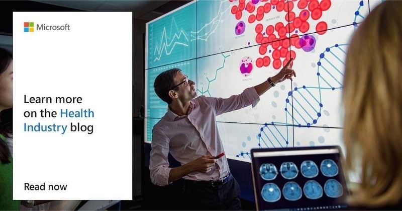 a man standing in front of a computer screen